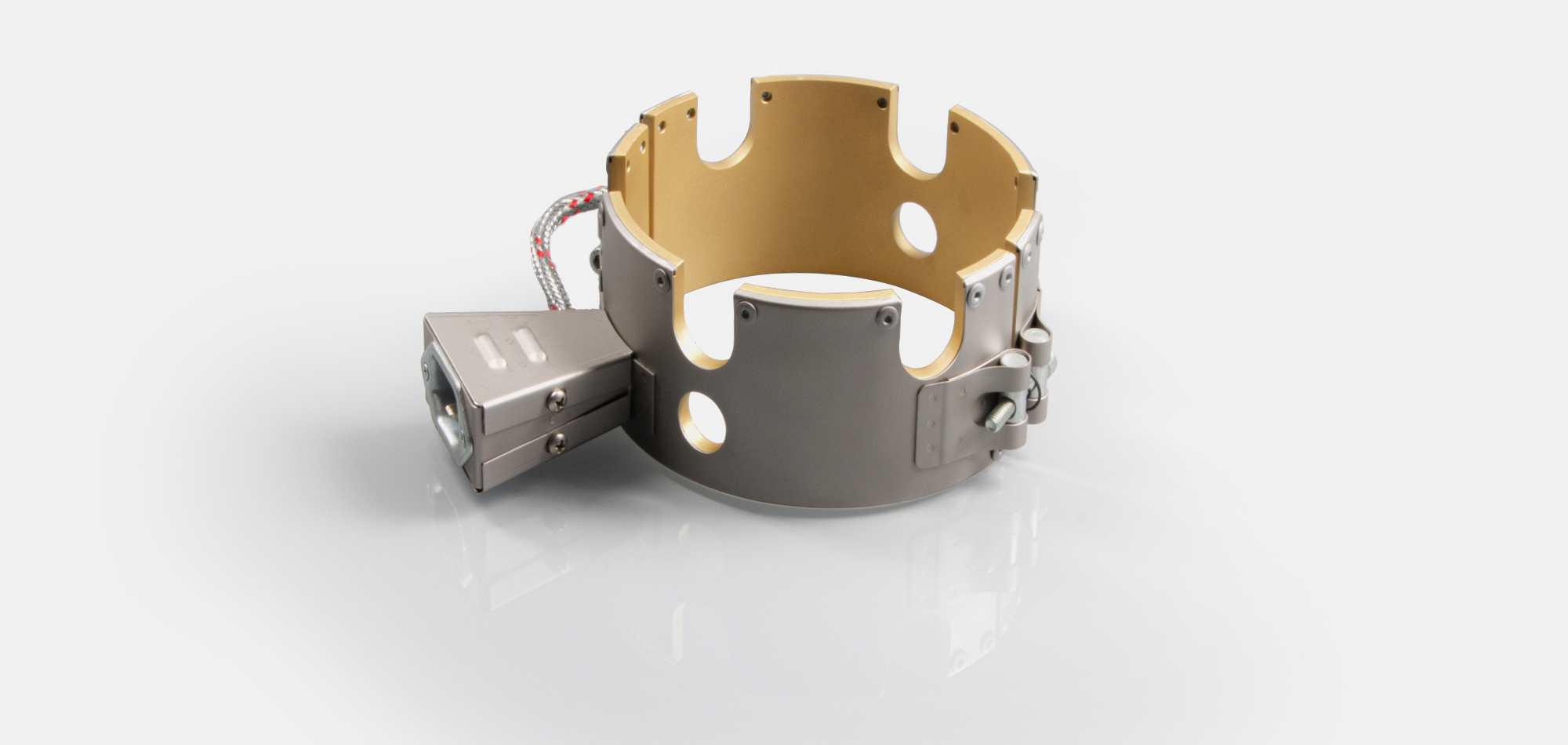 Düsenheizband, für Temperatur bis 450°C/550°C, Spitzguss, energieeffiziente Ausführung, homogener Wärmeverlauf, Bohrungen, Aussparungen, Wärmefühlerhaltung, integriertes Thermoelement, Sonderkontur, enge Einbauverhältnisse, Kabelextrusion