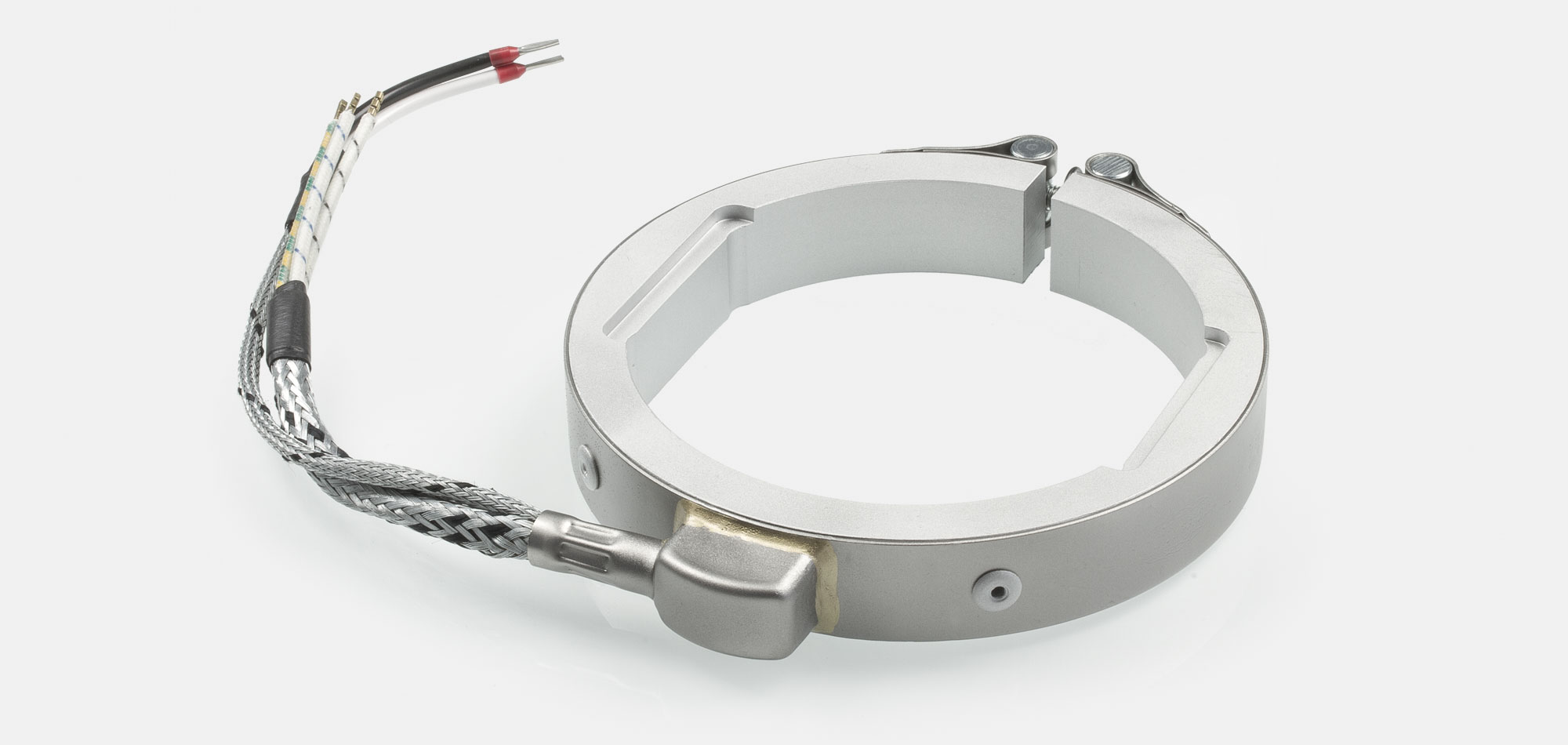 Düsenheizband, für Temperatur bis 450°C/550°C, Spitzguss, energieeffiziente Ausführung, homogener Wärmeverlauf, Bohrungen, Aussparungen, Wärmefühlerhaltung, integriertes Thermoelement, Sonderkontur, enge Einbauverhältnisse, Kabelextrusion