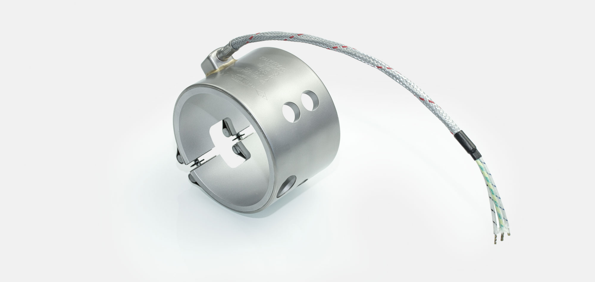 Düsenheizband, für Temperatur bis 450°C/550°C, Spitzguss, energieeffiziente Ausführung, homogener Wärmeverlauf, Bohrungen, Aussparungen, Wärmefühlerhaltung, integriertes Thermoelement, Sonderkontur, enge Einbauverhältnisse, Kabelextrusion