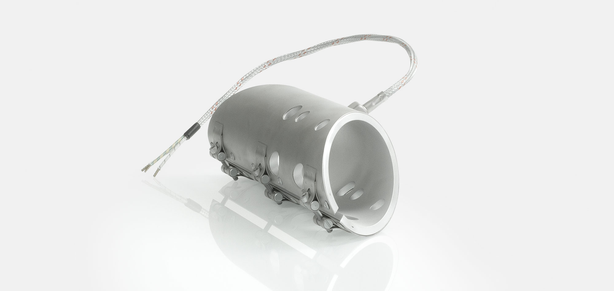 Düsenheizband, für Temperatur bis 450°C/550°C, Spitzguss, energieeffiziente Ausführung, homogener Wärmeverlauf, Bohrungen, Aussparungen, Wärmefühlerhaltung, integriertes Thermoelement, Sonderkontur, enge Einbauverhältnisse, Kabelextrusion