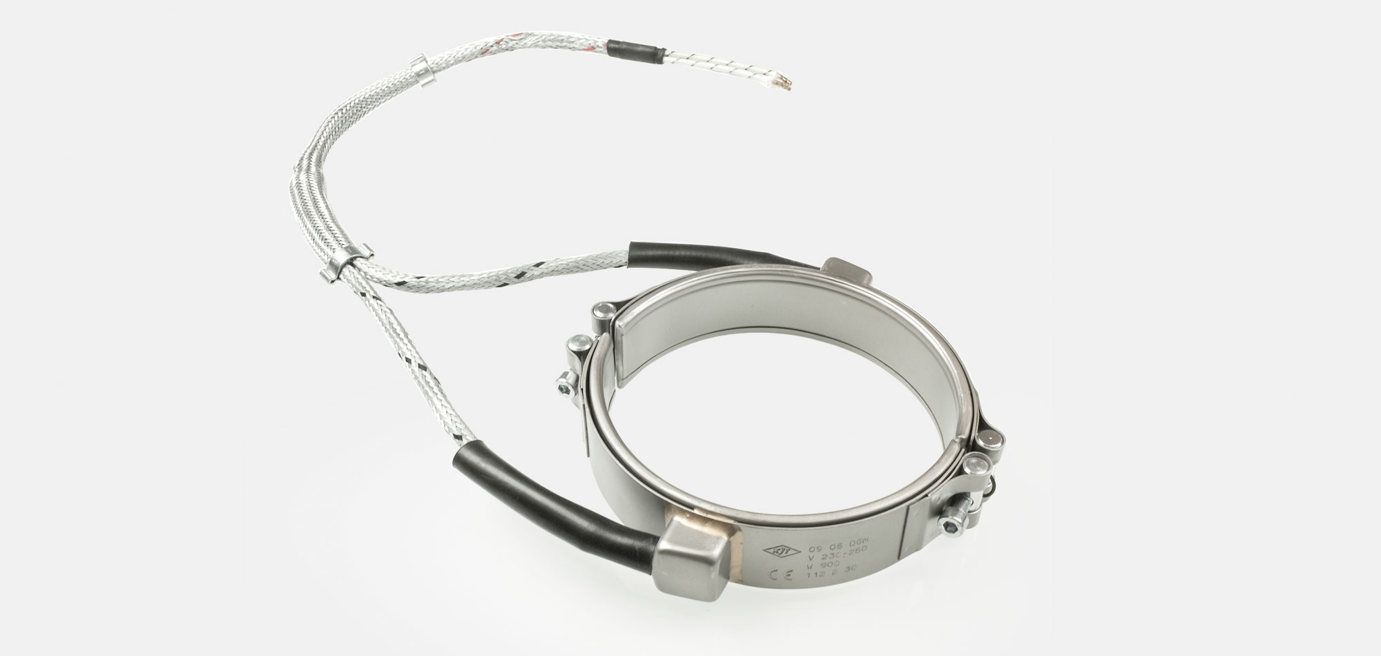 Hochleistungs-Düsenheizband, Temperatur bis 600°C, Spitzguss, Bohrungen, Aussparungen, Wärmefühlerhaltung, integriertes Thermoelement, enge Einbauverhältnisse, anspruchsvolle Materialien,  PTFE-PEEK Verarbeitung, verringerte Zykluszeiten, Kabelextrusion